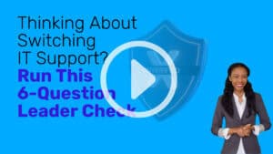 Video thumbnail with bright blue background. Large text reads “Thinking About Switching IT Support? Run This 6-Question Leader Check.” A faded shield icon in the center shows an “X” and the word “UNVERIFIED.” A large play button in the foreground. A smiling woman presenter in a blazer on the right side.